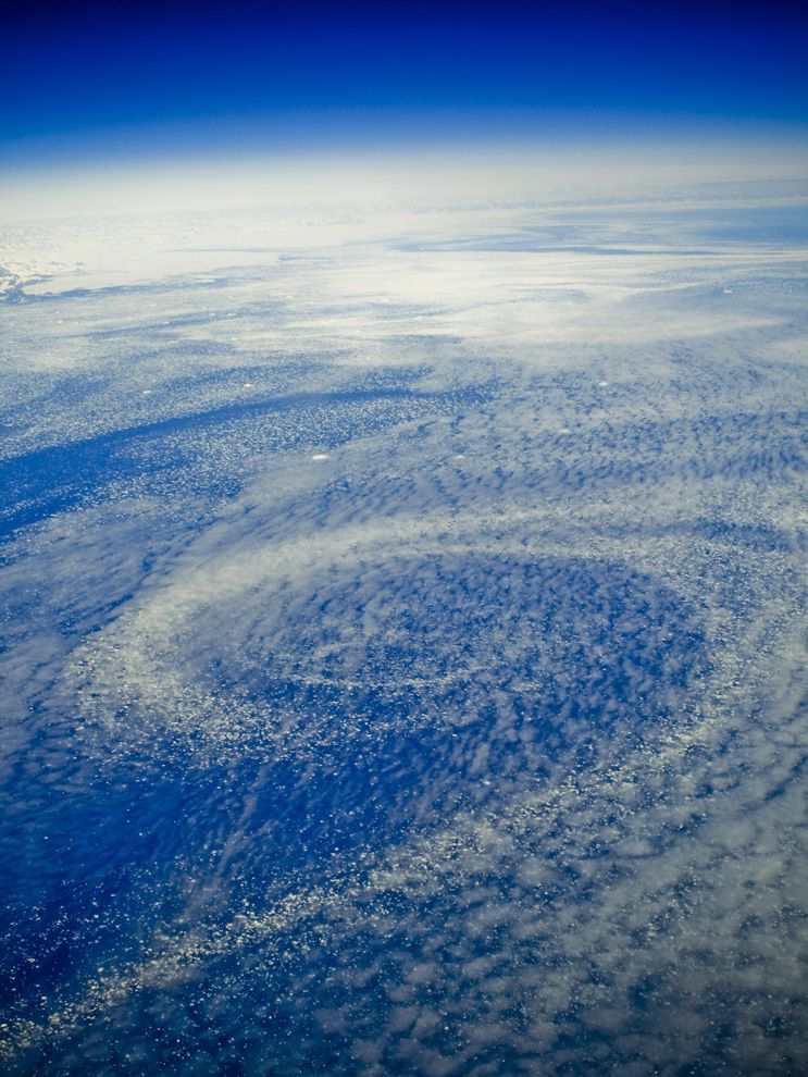 Icebergs form over this ocean gyre in the North Atlantic Ocean, near the southeastern coast of Greenland. Wind patterns and the rotation of the Earth cause spiral or circular currents to form in the ocean. These currents are called gyres.