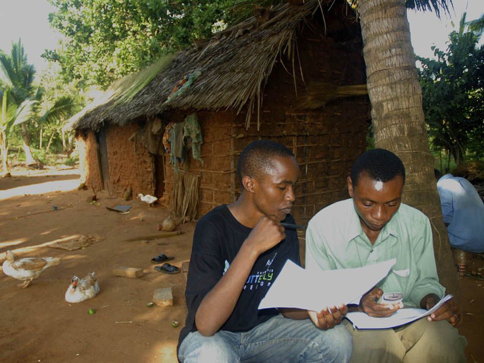 Mobile phones can be used by scientists, conservationists, and demographers, like these workers in Kenya. The relatively simple technology allows users to communicate with individuals or communities. FrontlineSMS, a free application, has been used by organizations to document human trafficking, political unrest, and domestic violence.