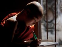 Picture of a monk writing.