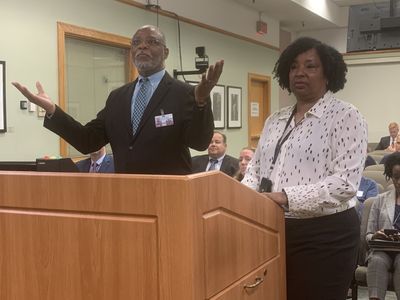 <p>Different parts of the United States government&mdash;whether it be federal, state, or city&mdash;play different roles in serving their communities. Here, Tampa, Florida, purchasing director Gregory Spearman, left, speaks at a city council meeting.</p>