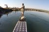 Picture of Steve Boyes with boat carrying solar panels