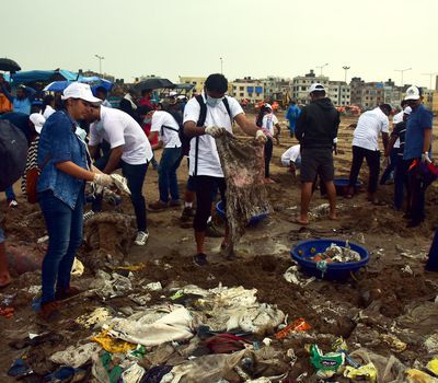 <p>This lesson will teach students how to conduct field research on plastic waste. Here, volunteers clean up trash at Versova Beach in Mumbai, India.</p>