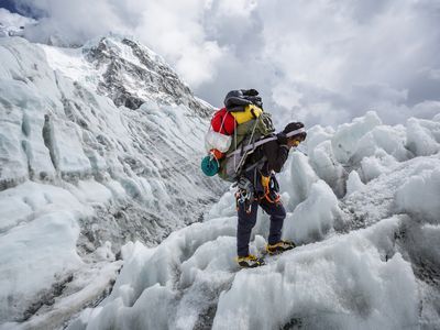 Khumbu Ice Fall, Nepal. A Sherpa packs down gear from Camp Two on Mount Everest.