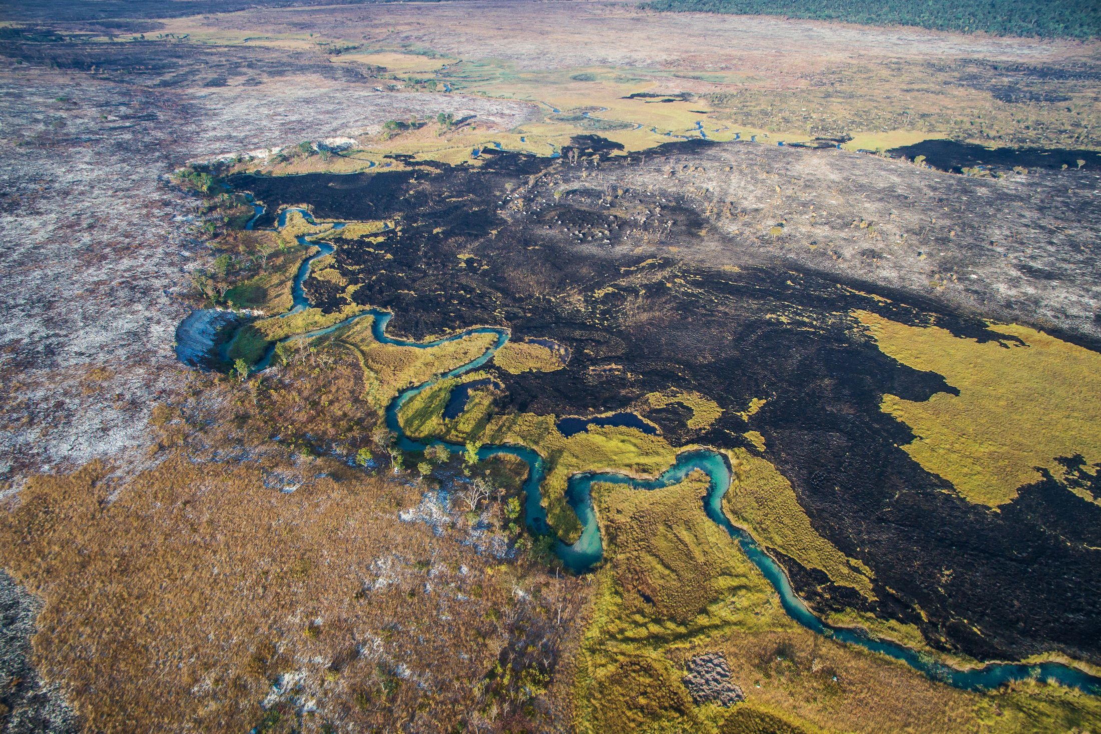 Picture of river and remnants of a fire in the Okavango Delta in 2015 Picture of river and remnants of a fire in the Okavango Delta in 2015
