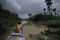 A man paddles through murky water in Amapa, Brazil. Many Northern Brazilians depend on the land in and around the Amazon to sustain their livelihoods.
