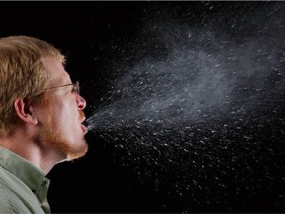<p>A sneeze in progress was captured&nbsp;showcasing droplets of saliva spaying some distance away from the individual. Covering your mouth protects others from germ exposure.</p>