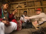 Photo: Greg Anderson and Ganesh Murmu interview a woman (name withheld) from the Aka tribal group