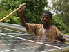 Tending solar panels in Benin, Africa